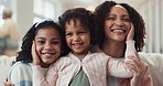 Mother, happy children and face for laughter in home, love and funny comedy for bonding. Mom, daughter and girl for connection in embrace, portrait and kids for security in relationship or support