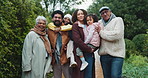 Happy, nature and face of family generations in national park for winter holiday, getaway or adventure. Smile, portrait and kids with parents and grandparents in field for weekend trip in Colombia.
