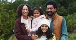 Happy, nature and face of family in outdoor national park for winter holiday, getaway or adventure. Smile, fun and portrait of girl kids with mother and father in field for weekend trip in Colombia.