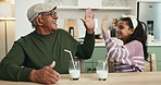 Girl, grandfather and happy with high five in kitchen with milk, care or bonding for connection in home. Senior man, child and drink for dairy, nutrition or diet for cheers with love in family house