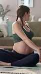 Pregnant woman, stretching and exercise on floor in home for pelvic strength, maternity fitness and improve flexibility. Girl, living room and prenatal yoga for circulation, back pain and posture.