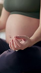 Pregnant woman, yoga and hand for meditation with wellness, pregnancy balance and mindfulness at home. Stomach, chakra and prenatal and holistic practice for peace and calm before labour to relax