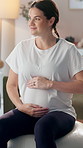 Happy, pregnant woman and exercise ball in home for pelvic floor strength, balance and prepare for labor with thoughts. Girl, prenatal yoga and maternity fitness for circulation, wellness and health.