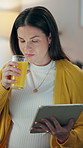 Woman, tablet and pregnant in home with orange juice, maternity app update and research. Future mom, drinking and tech in living room for vitamin C, prenatal progress or read medical insurance policy