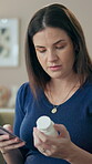 Woman, pills and phone for pregnancy in home, reading and website for label information research. Female person, prenatal vitamin bottle and app for healthcare knowledge, maternity medicine and chat