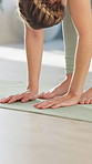 Yoga, person and hands on floor at feet for stretching, warm up and muscle relaxation at home. Woman, pilates or flexibility on mat for exercise, commitment or healthy body development in living room