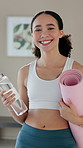 Yoga, mat or face of happy woman with water, smile or drink for liquid, wellness or healthy routine. Relax, portrait or proud girl with confidence in pilates, studio or break with bottle or hydration