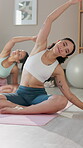 Women, stretching and fitness with yoga at gym for energy balance, posture progress and mindfulness healing. People, pilates and exercise for peace performance, stress relief and breathing in morning