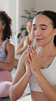 Women, meditation and fitness with yoga at gym for spiritual healing, mindfulness and breath exercise of wellness. Smile, people and calm for chakra class, mental health and zen balance for holistic