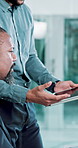 Office, meeting and business people on computer and tablet in discussion for feedback, review and help. Corporate, teamwork and man with manager talking for collaboration, website or research project