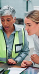 Collaboration, tablet and planning of women, warehouse and ideas of mechanical engineer with app. Discussion, mentor and teamwork in factory, mature person and instructions of information and online