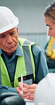 People, engineer and conversation with documents at warehouse for results, report and feedback. Supervisor, employees and meeting with paperwork for quality control, supply chain and teamwork