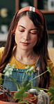 Girl, flower and transplant for winter, home garden and maintenance with horticulture or feng shui. Female person, cultivation and botany in house for balance, harmony and decor in sustainable design