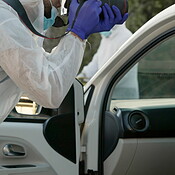 Forensic, photographer and car evidence at crime scene for ...