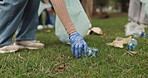 Trash, collect and volunteer in park for recycling with community service, waste or garbage pollution. Charity, bags and ngo worker cleaning grass of dirt for eco friendly project in environment.