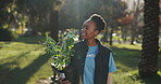 Volunteer, smile and black woman with plant in nature for community service, gardening or project. Environment, sustainability and person with leaves in park for NGO outreach, eco friendly or ecology