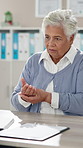 Senior woman, patient and explain for arthritis symptoms at office with painful hand or ache. Female person, consultation and doctor checkup with diagnosis for help, support and healthcare in clinic