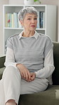 Mature woman, consulting and sofa with therapy session for difficulty, problems or talk at clinic. Senior female person or patient discussing issue for healthcare service, diagnosis or medical advice