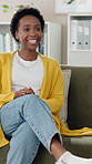 Black woman, patient and talking with psychiatrist for therapy session or appointment on sofa at clinic. Young African or female person in consultation with psychologist for health advice or help