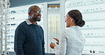 People, optometry and eye test for glasses with specialist, consultation and medical professional. Male person, spectacles and optometrist in clinic or ophthalmology center for size, frame and lens