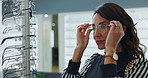 Woman, optometry and choosing glasses for eye care, consultation and optometrist with happiness. Female person, spectacles and option in clinic or ophthalmology center for size, frame and single lens