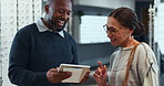 Eye care, woman and optometrist with tablet in store for prescription lenses, glasses information and consultation. Optometry, client and optical assistant with digital website for frame planning