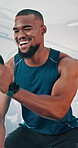 Black man, battle rope and smile for fitness at gym with power training, resilience workout or muscle exercise. Athlete, equipment and health for performance, cardio challenge and strong bodybuilding