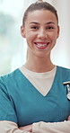 Crossed arms, woman and face of nurse with smile for healthcare career with pride for wellness service. Happy, confident and portrait of caregiver from Canada with medical job at nursing facility.