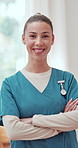 Crossed arms, woman and face of nurse with happiness for healthcare career with pride for wellness service. Smile, confident and portrait of caregiver from Canada with medical job at nursing facility