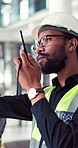 Business people, radio and men with architecture, construction site and logistics with planning. Employees, builders and coworkers with safety, instruction and discussion for engineering and shipping