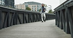 Bridge, business and man with happiness in phone call for communication and networking in New York. Male person, employee and smile or satisfied on conversation or consultation for real estate
