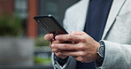 Man, hands and phone in city for business, communication and check email agenda. Person, typing and scroll on mobile for information, networking and transport app for commute at office park building