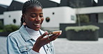 Talking, outdoor and black woman with cellphone, buildings and excited for sightseeing of houses and online. City, real estate and influencer with smile, thinking and happy for opportunity in Canada