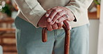 Hands, senior man and cane with Arthritis, elderly care or wellness for health or balance. Pensioner, person with a disability and walking stick for support, retirement home or rehabilitation clinic