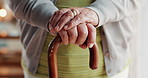 Hands, senior woman and walking stick with Arthritis, elderly care or wellness for health. Pensioner, person with disability and cane for age related illness, retirement home or rehabilitation clinic