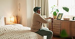 Senior man, thinking and relax in bedroom with picture frame, nostalgia memory and partner loss of empathy. Elderly person, walking stick and check album, remember history and lonely life at home