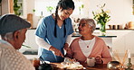 Assisted living, cake and nurse with old couple for dessert or visit in retirement home together. Cutting, food or tea with professional caregiver, senior man and woman in dining room of apartment