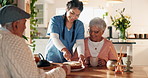 Assisted living, nurse and old couple cutting cake for visit in retirement home together. Dessert, smile or tea with professional caretaker, senior man and happy woman in dining room of apartment