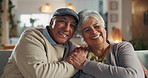Old couple, face and hug in home for commitment, care and love for comfort in lounge. Elderly people, couch embrace and romance in retirement portrait, security and bonding for trust in marriage