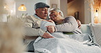 Old couple, laugh and playful conversation in home, support and blanket for comfort in lounge. Elderly people, winter embrace and funny humor in retirement, talking and joke for love in marriage