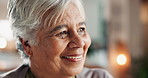 Senior woman, thinking and happy for retirement in home, comfort and security for future. Elderly person, smile and face in living room for nostalgia, memory or mortgage freedom or pride in apartment