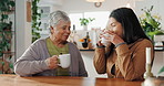 Senior mother, daughter and drinking coffee in kitchen with care, bonding and gratitude. Elderly person, woman and talking in retirement home for wellness, weekly visit and support as happy family