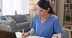 Woman doctor, writing and notebook in practice for healthcare, schedule and research for diagnosis. Specialist, laptop and paperwork at table for consultation preparation with medical references
