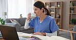 Woman, nurse and drinking with coffee for medical study, research or knowledge on computer or books at home. Female person, med student or intern working with caffeine for healthcare theory at house