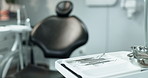 Healthcare, dentist and chair with tools in office, oral hygiene or wellness with ergonomics. Medical, tray or trust in uniform, oral practice or clean with equipment, clinic or consult with medicare
