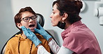 Checkup, child and dentist assistant for procedure progress in hospital, oral care clinic or office. Woman, consultation and kid as dental hygienist for teeth cleaning, root canal treatment or braces