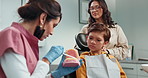 Healthcare, dentist and patient with checkup, explain and teeth whitening with consultation. Service, medical and professional with equipment, tools or mouth cleaning with advice, talk or appointment