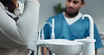 Woman, patient and dentist with rinsing mouth for preparation procedure in hospital or oral care clinic. Female person, health professional and hygiene for teeth cleaning, tooth extraction or filling