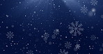 Christmas, particles and snowflakes on dark background space for digital card, creativity and festive season. Snow animation, bokeh spots and glitter on wallpaper for texture, sparkle and celebration