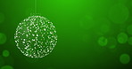 Christmas, glitter ball and celebration with light, glow and magic on green studio background. Empty, bokeh and event with banner, abstract or party with design, light or creative with sign or symbol